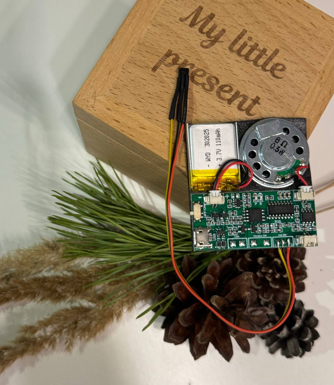 Re-recordable sound module with a magnetic sensor for gifts